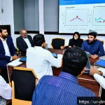 Home 20 수집품 투자자 커뮤니티의 중요성 - A diverse group of Urdu-speaking investors gathered in a modern community center in Karachi, Pakista...